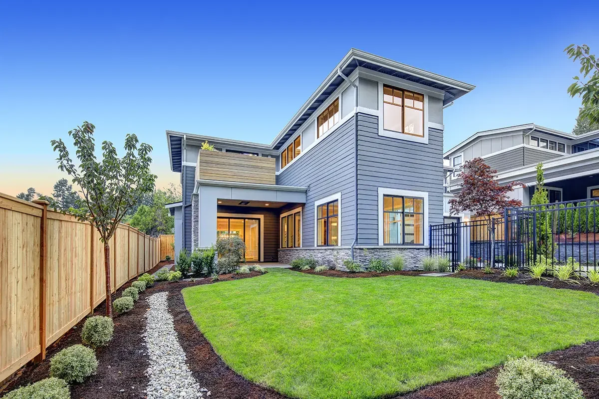 picture-of-a-two-story-home-featuring-blue-lap-siding-gray-stone