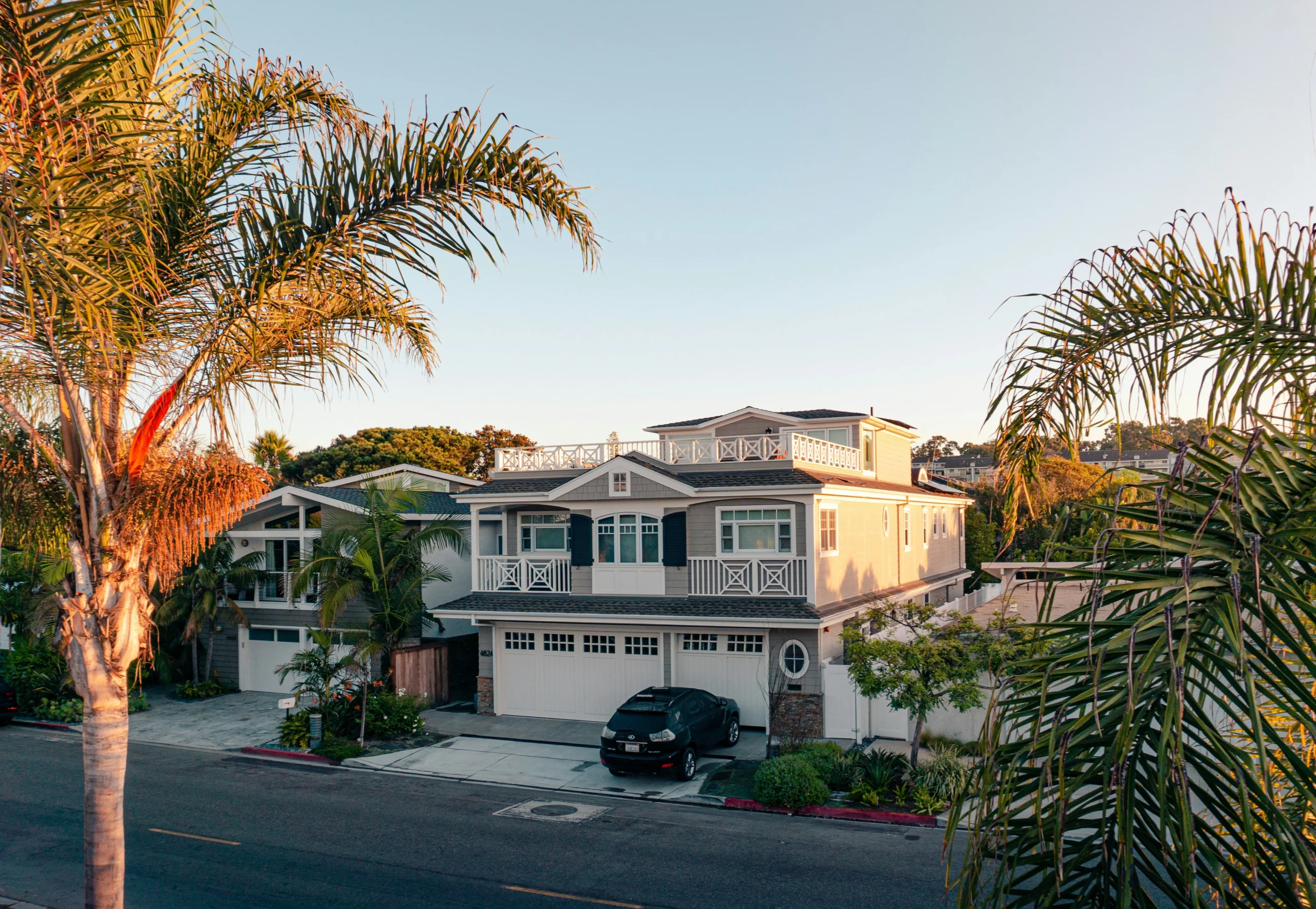 photo-of-a-gray-home-remodeling-manhattan-beach-house-surrounded-by-palm-trees-scaled photo of a gray home remodeling manhattan beach house surrounded by palm trees scaled
