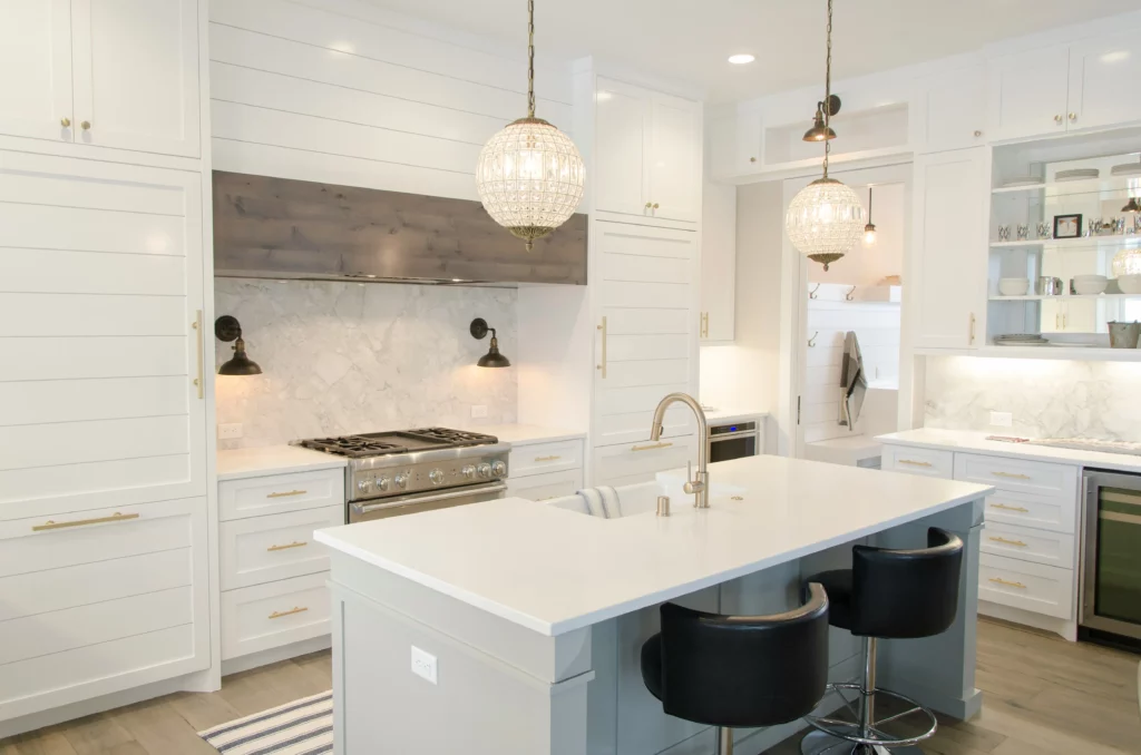 photo-of-a-white-kitchen-remodeling-woodland-hills-project-with-bright-light-fixtures-above-a-white-granite-island-facing-white-wood-panel-cabinets-1024×678 photo of a white kitchen remodeling woodland hills project with bright light fixtures above a white granite island facing white wood panel cabinets in LA